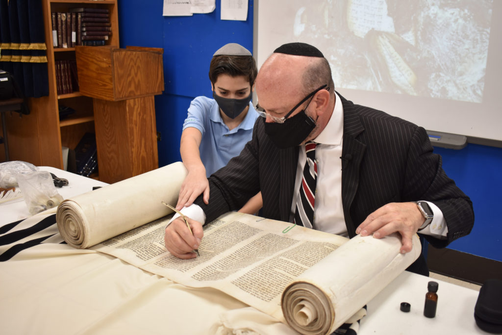Skokie students participate as scribe restores torah that survived Holocaust